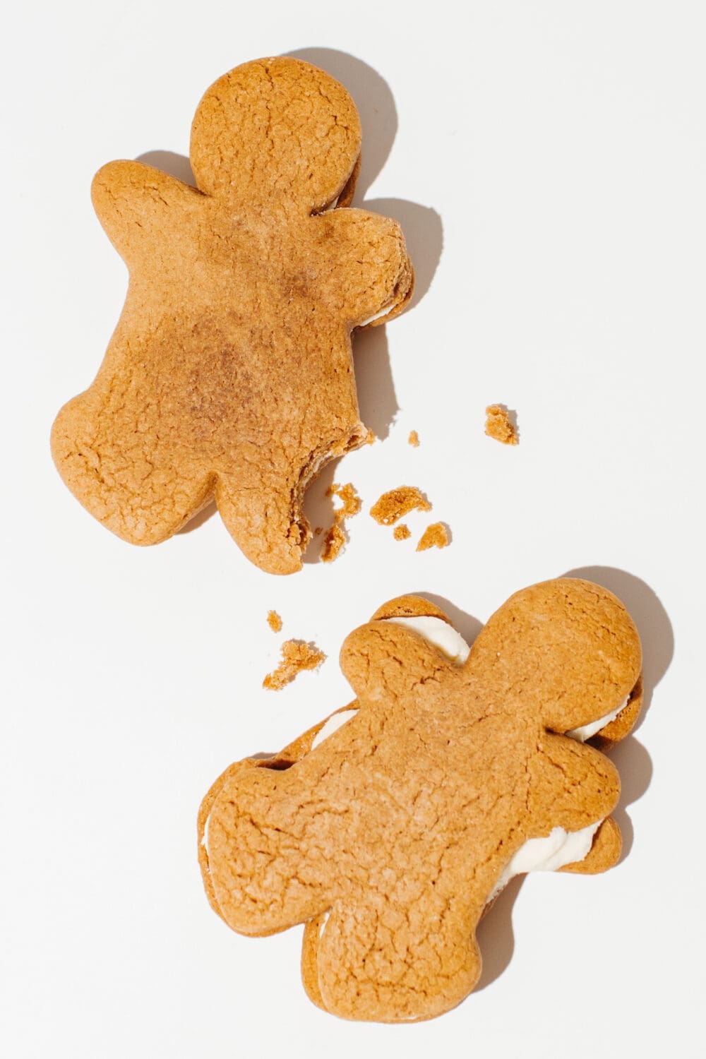 2 Ounce of Hope gingerbread creme pies, one above the other, with the top showing a bite taken out of the foot, and crumbs in between