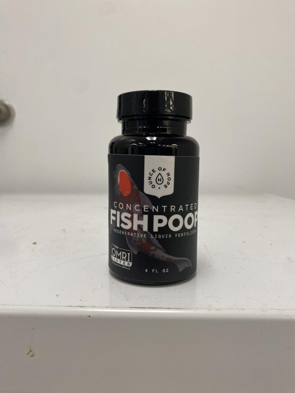 4 fl oz container of Ounce of Hope's concentrated fish poop